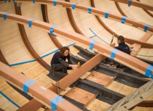Spirit Yachts | Craftsmanship | Craftswomen working on the hull of a Spirit Yacht